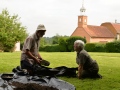 Sifting through soil at Test Pit 3.