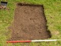 Official photo of Test Pit 1 with top soil removed.