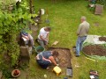 Test Pit 2 with top soil being removed.