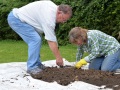 Sifting soil from Test Pit 1.