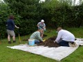 Removing soil from Test Pit 1.