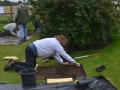 Removing the first layer of soil in Test Pit 1.