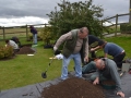 Test Pit 1 soil being sieved.