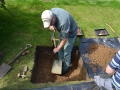 Removing soil from Test Pit 1.