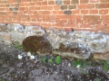 Stonework of the Abbey below Tudor brick.